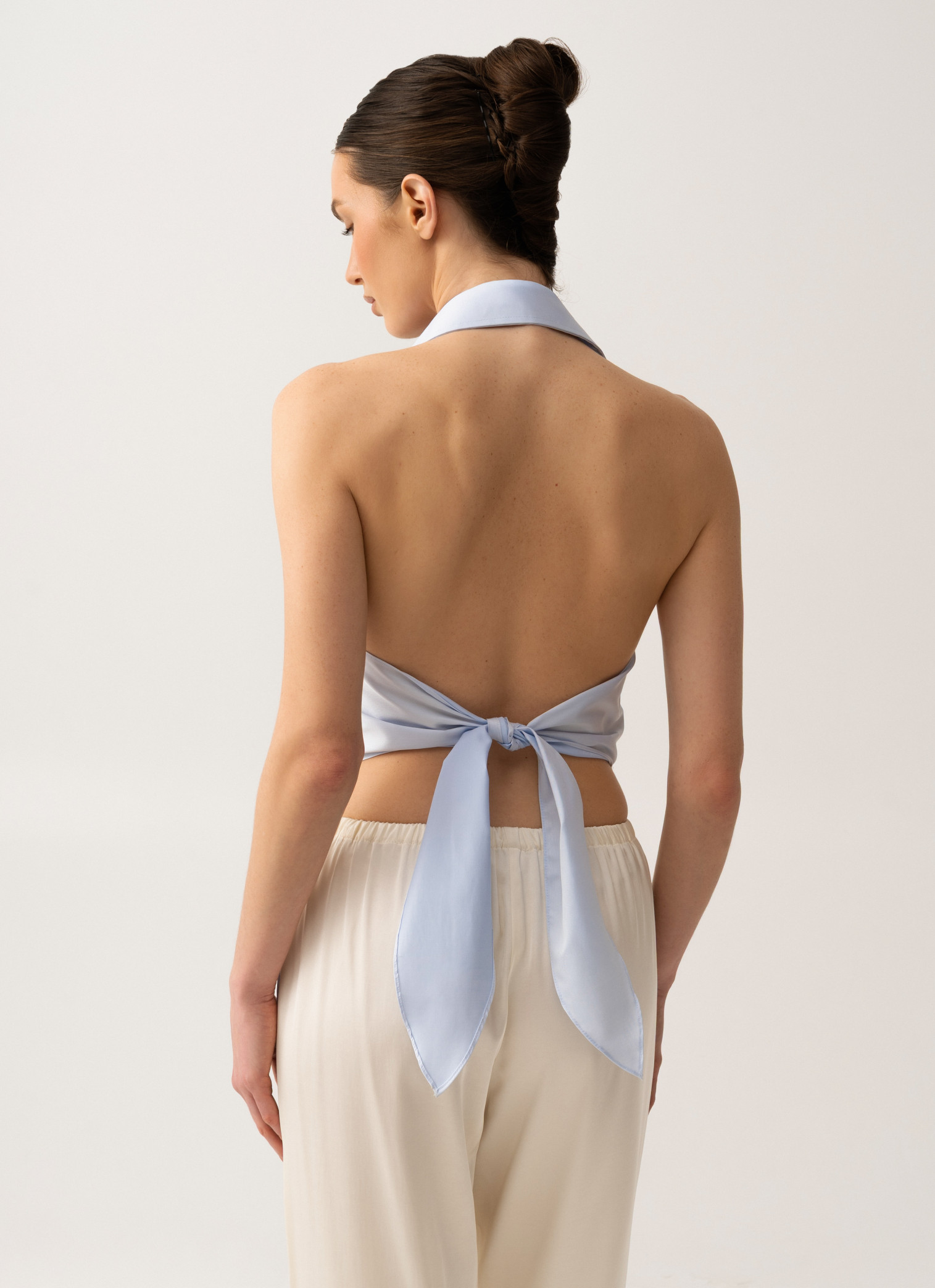 Shirt with an open back